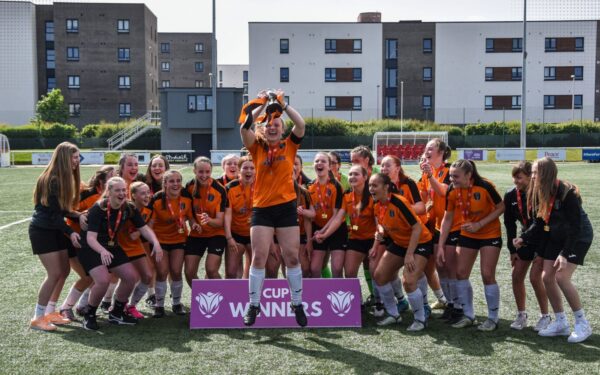 U18 NAP lifting the League Cup trophy.